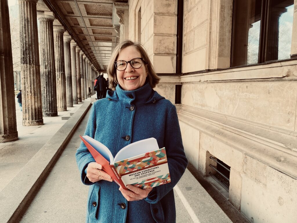 Me reading my book in front of a museum